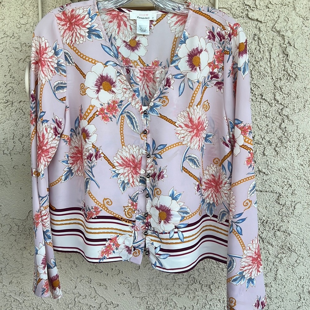 Ladies LS (flared) pink blouse w/flowers. Round buttons on front.